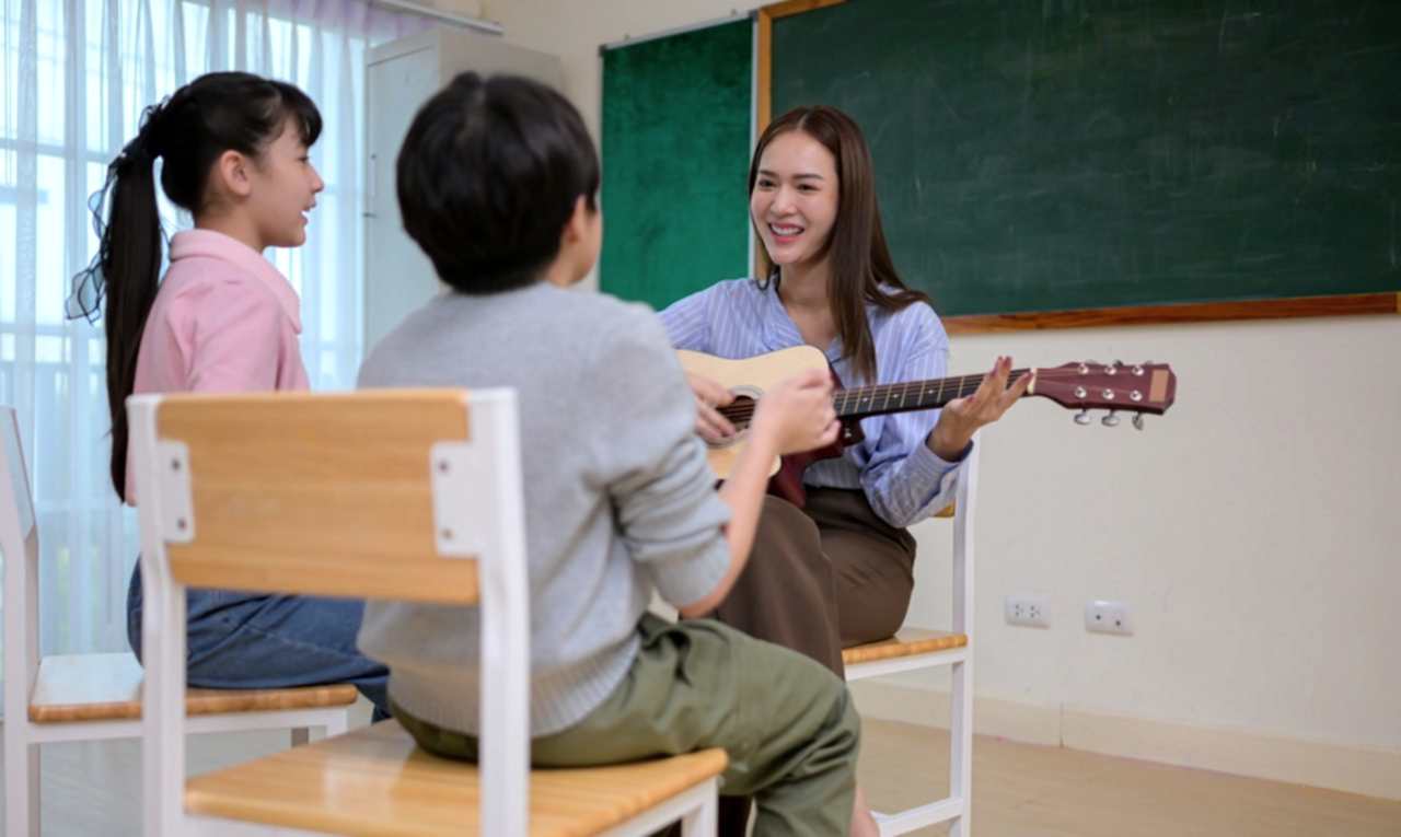 Guitar Class, Teacher and students in music classroom